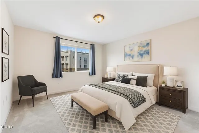 a bedroom with a bed and a couch