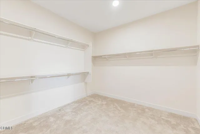 a view of an empty walk in closet