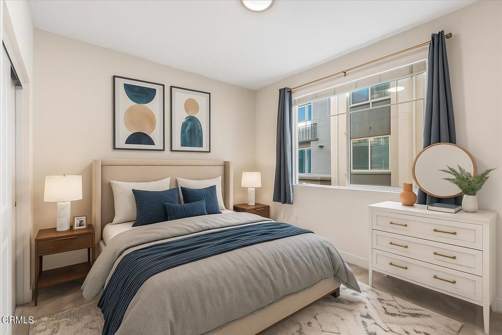 2830 Wagon Wheel Road, Unit 304 Oxnard, CA 93036 - Photo 20 of 45 a bedroom with a large bed and a window