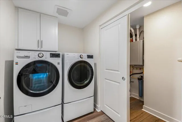a view of a hallway with washer and dryer
