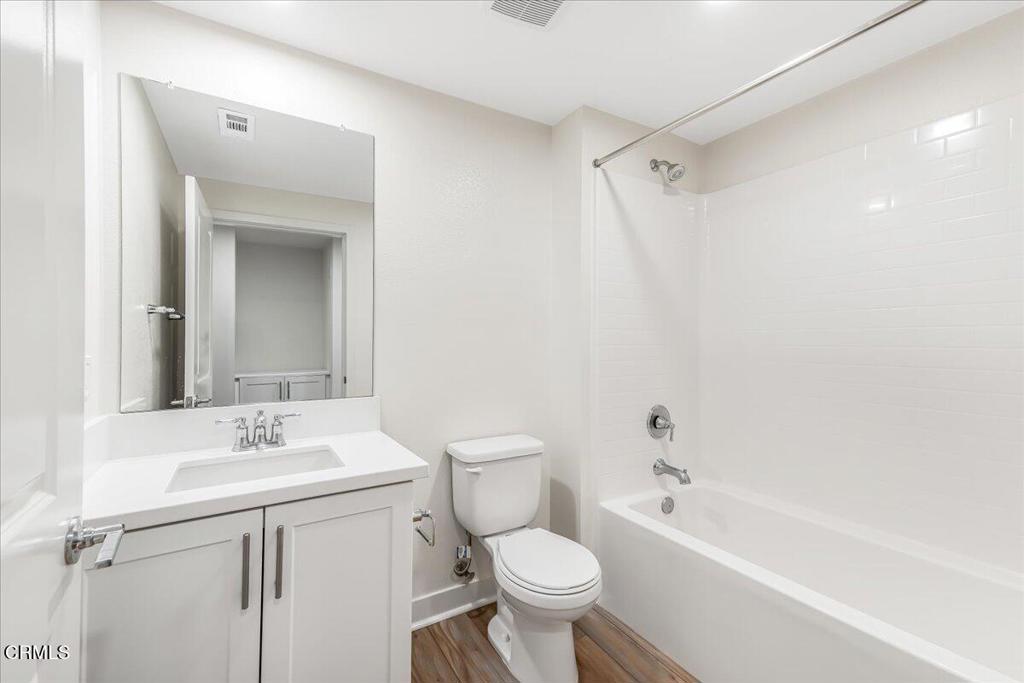 2830 Wagon Wheel Road, Unit 304 Oxnard, CA 93036 - Photo 25 of 45 a bathroom with a toilet sink vanity tub and shower