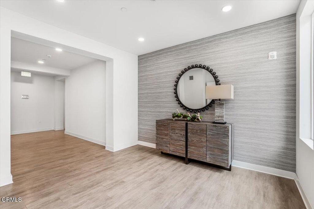 2830 Wagon Wheel Road, Unit 304 Oxnard, CA 93036 - Photo 29 of 45 a view of a livingroom with wooden floor and window