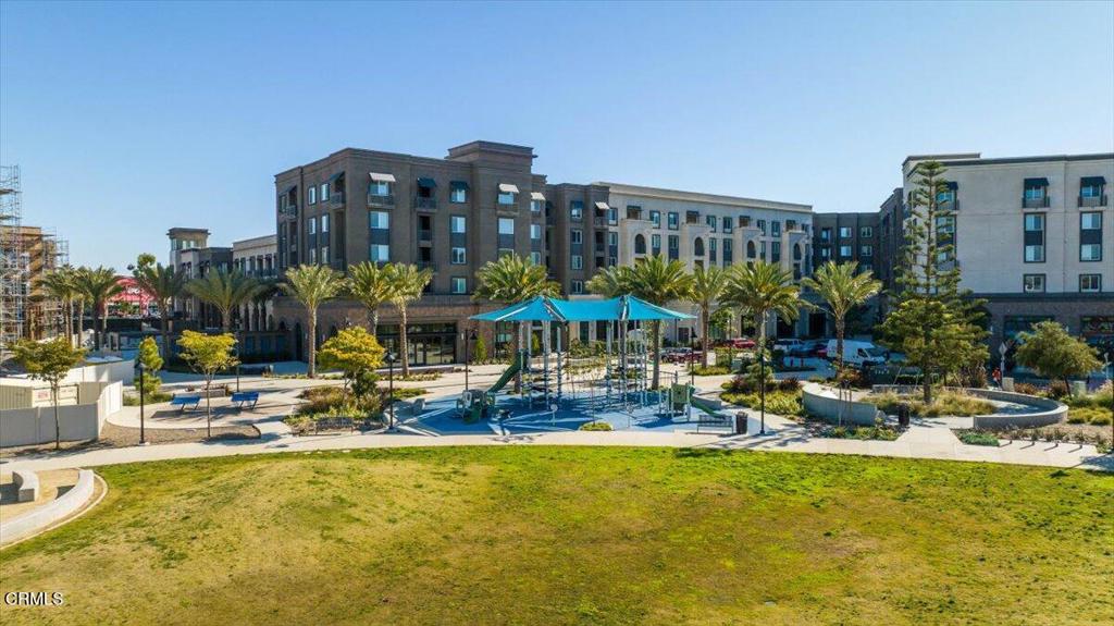 2830 Wagon Wheel Road, Unit 304 Oxnard, CA 93036 - Photo 41 of 45 a building outdoor space with swimming pool and outdoor seating