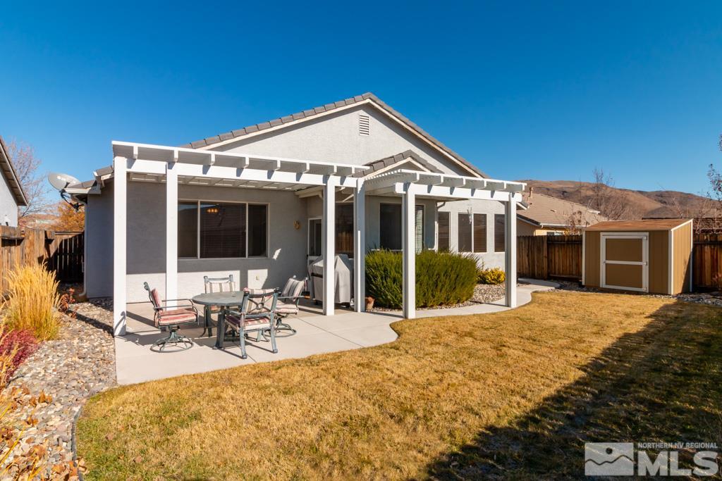 9575 Navigator Drive Reno, NV 89521 - Photo 13 of 13 a view of a house with backyard porch and sitting area
