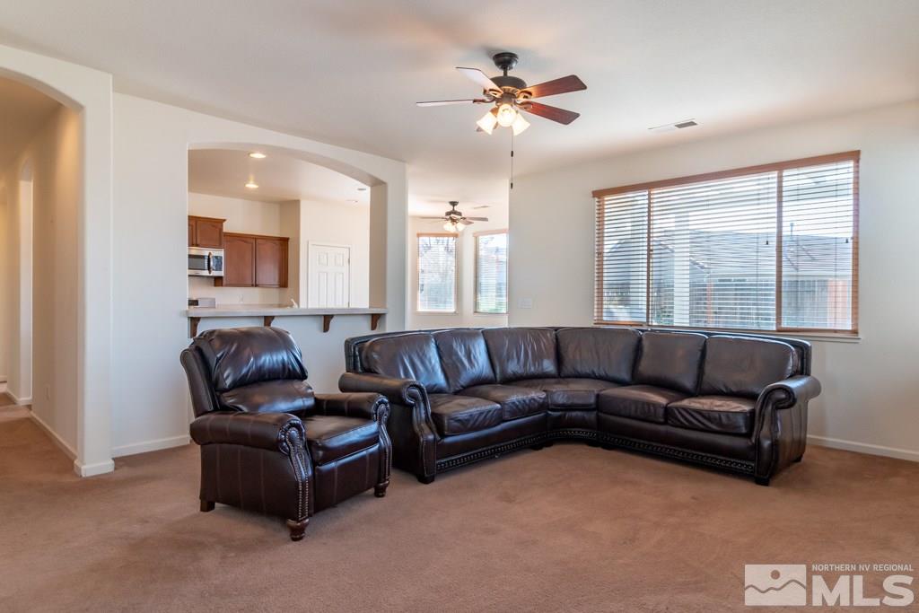 9575 Navigator Drive Reno, NV 89521 - Photo 3 of 13 a living room with furniture and a large window