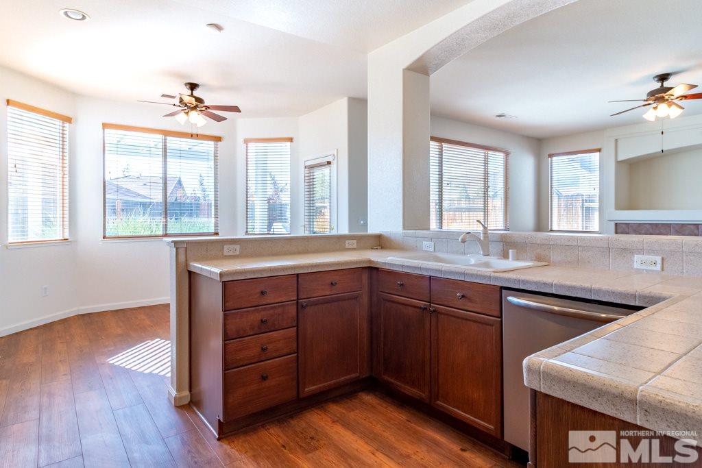 9575 Navigator Drive Reno, NV 89521 - Photo 6 of 13 a spacious bathroom with a granite countertop sink and a large mirror