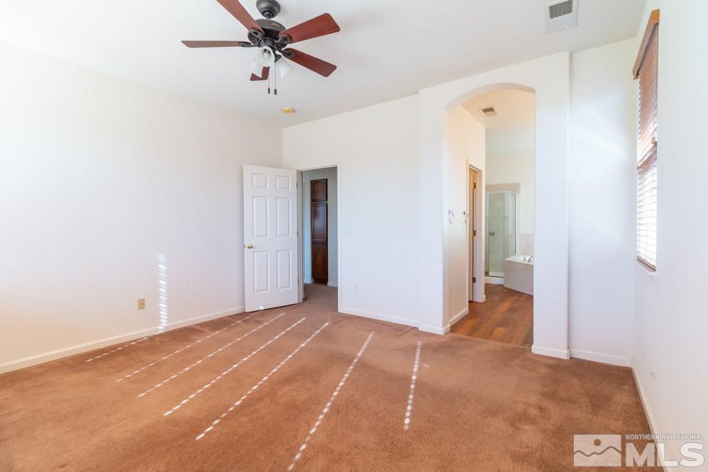 9575 Navigator Drive Reno, NV 89521 - Photo 7 of 13 a view of a room with a ceiling fan and entryway