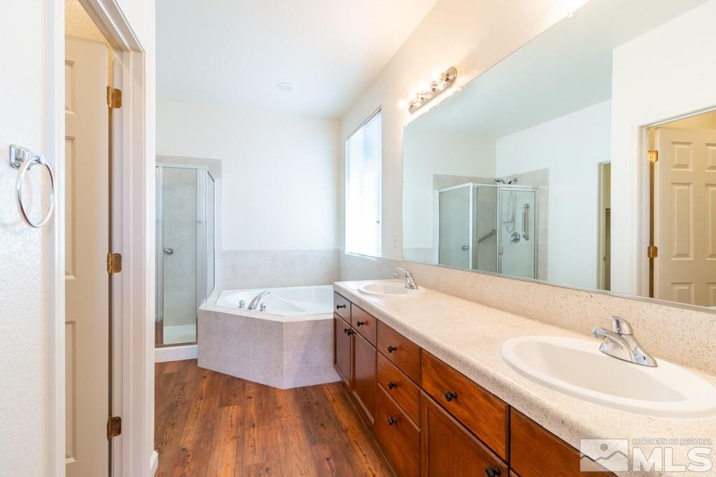 9575 Navigator Drive Reno, NV 89521 - Photo 8 of 13 a spacious bathroom with a double vanity sink mirror and double
