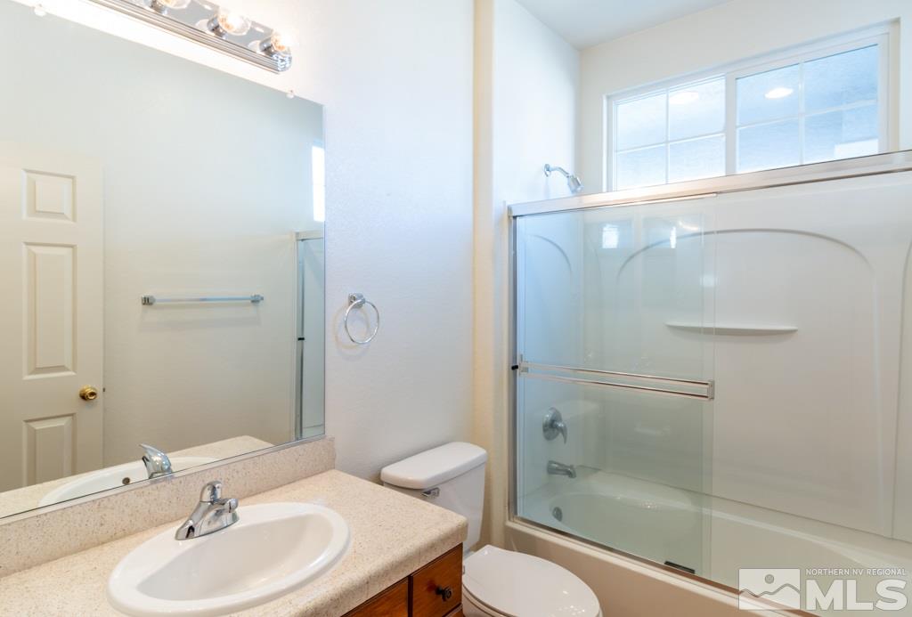 9575 Navigator Drive Reno, NV 89521 - Photo 10 of 13 a bathroom with a sink toilet and shower