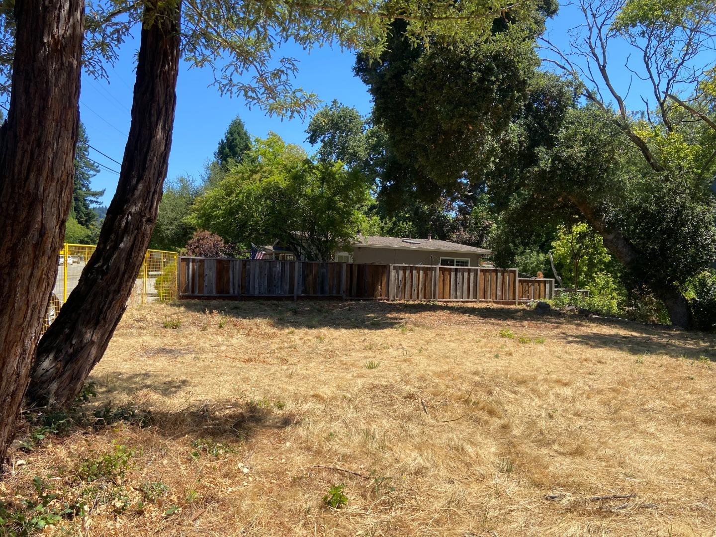 0 Vine Hill School Road Scotts Valley, CA 95066 - Photo 1 of 3 a view of a backyard with large trees and wooden fence