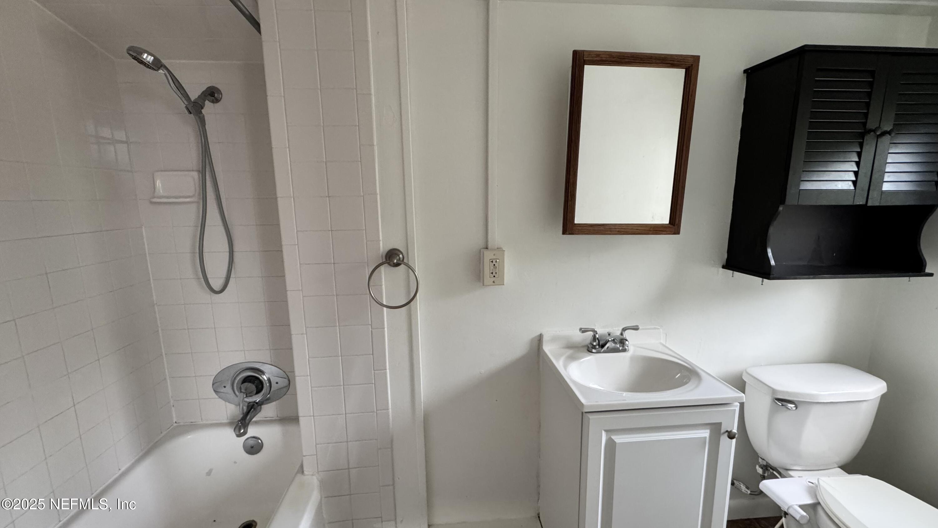 32 Sanford Street St. Augustine, FL 32084 - Photo 12 of 13 a bathroom with a sink toilet and shower