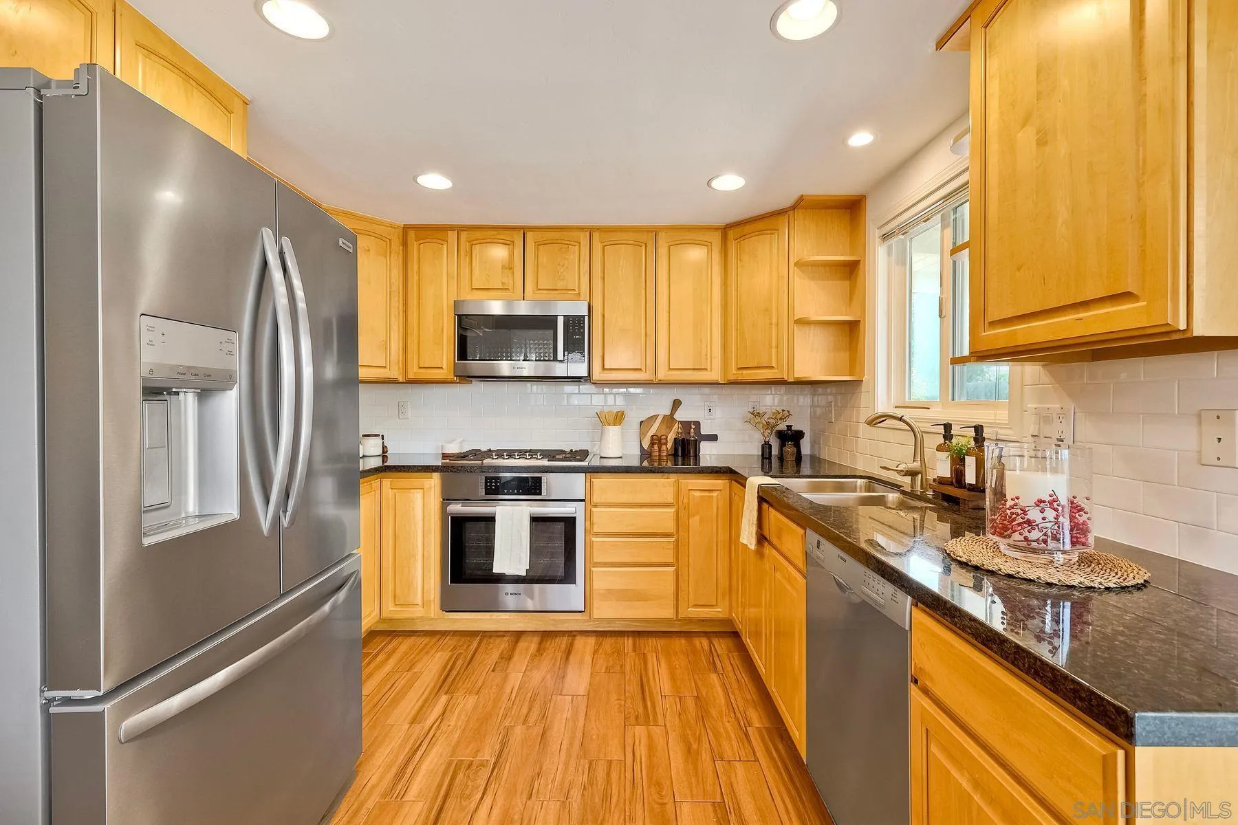 8850 Ellsworth Circle Santee, CA 92071 - Photo 12 of 29 a kitchen with stainless steel appliances granite countertop a stove a sink a refrigerator and cabinets