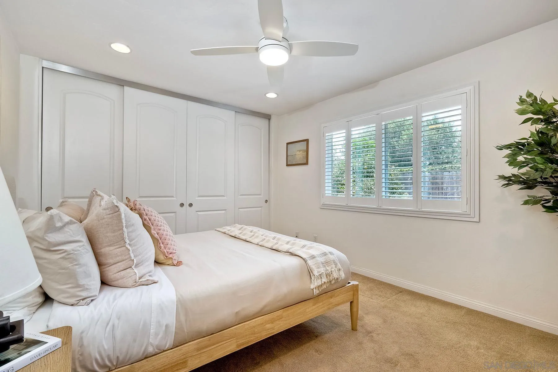 8850 Ellsworth Circle Santee, CA 92071 - Photo 14 of 29 a bedroom with a large bed and a chandelier