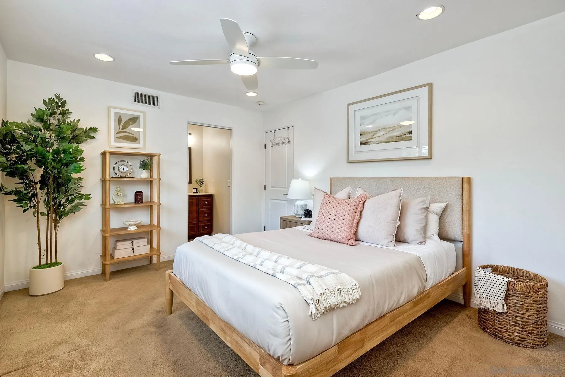 8850 Ellsworth Circle Santee, CA 92071 - Photo 16 of 29 a bedroom with a large bed and a chandelier