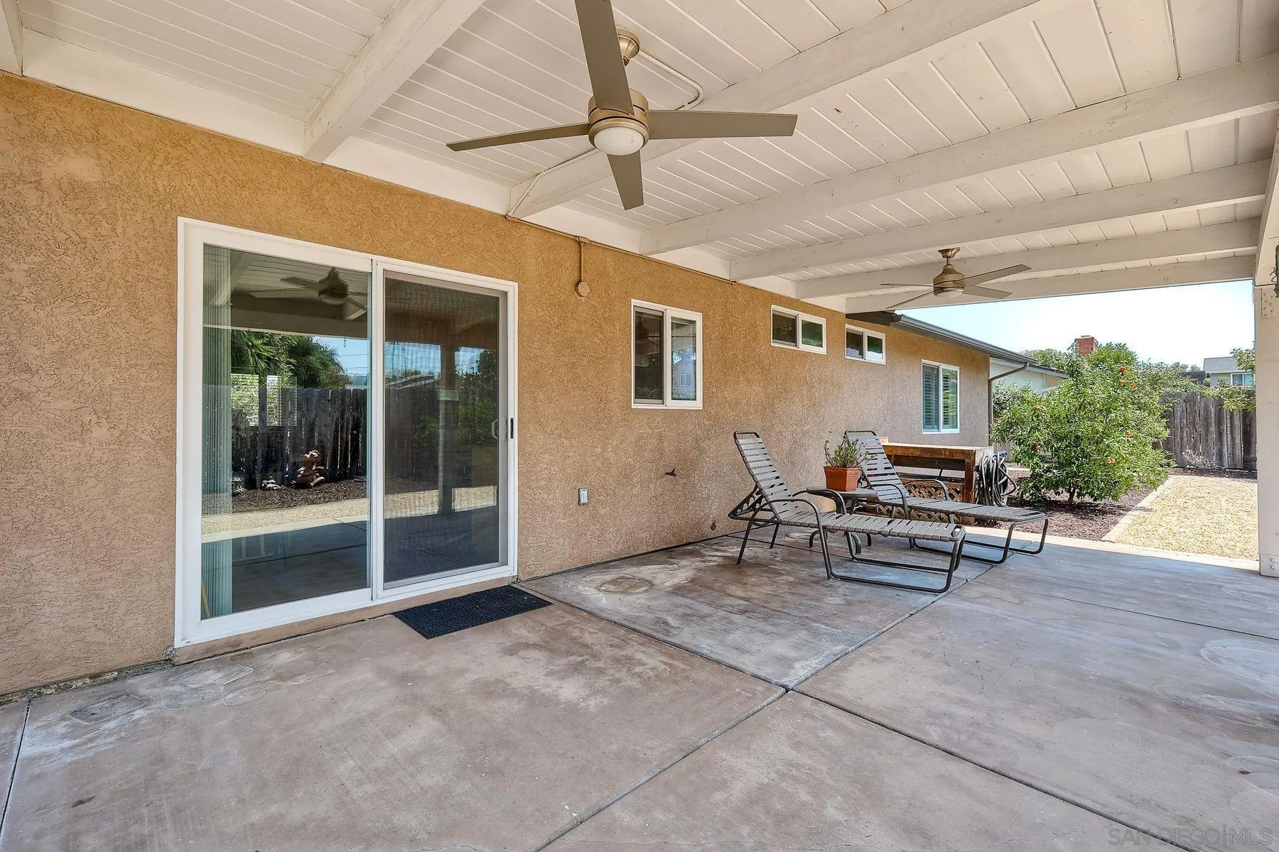 8850 Ellsworth Circle Santee, CA 92071 - Photo 26 of 29 a view of a patio with table and chairs under an umbrella