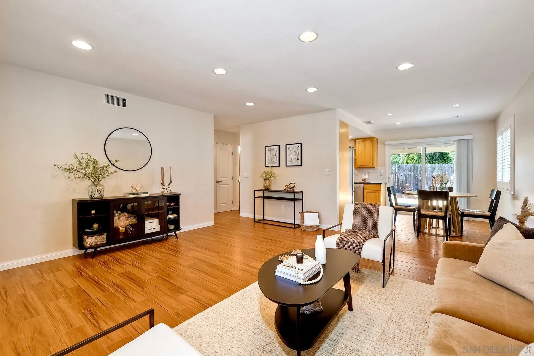 8850 Ellsworth Circle Santee, CA 92071 - Photo 8 of 29 a living room with furniture a rug and a fireplace