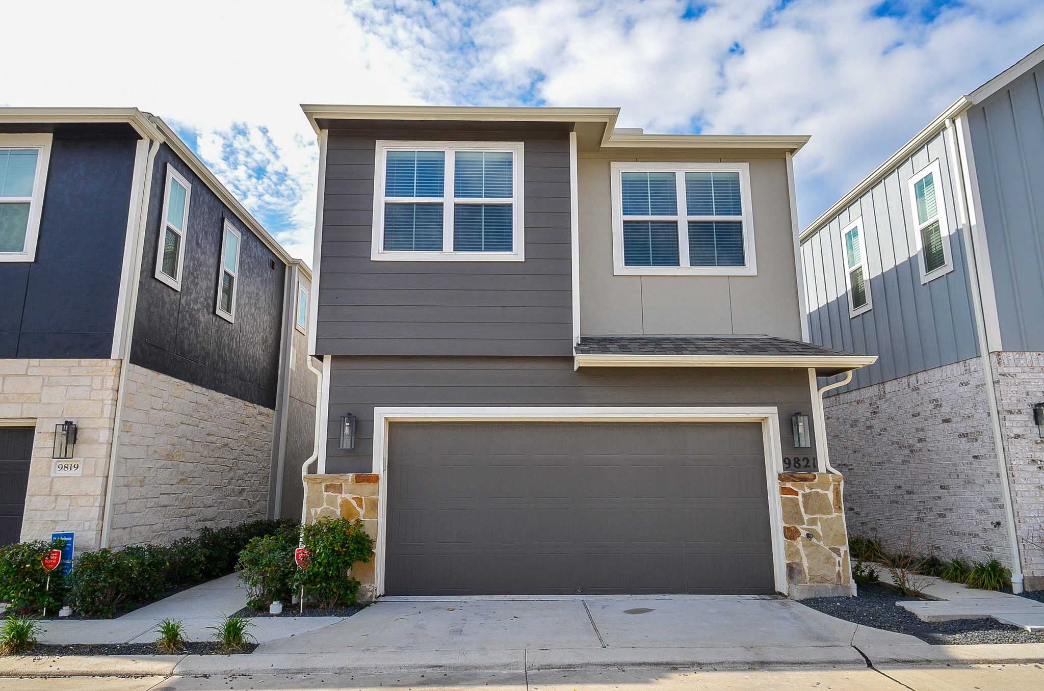 a front view of a house with a garage