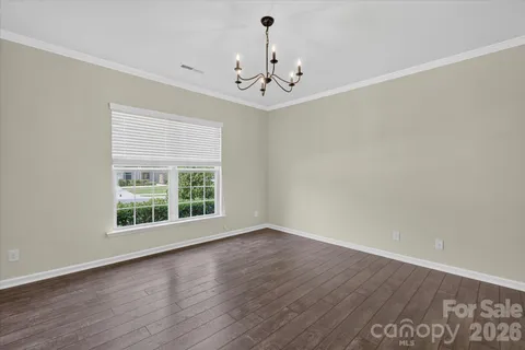 a kitchen with stainless steel appliances granite countertop a kitchen island and a refrigerator