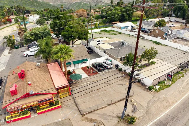 an aerial view of a houses with a street