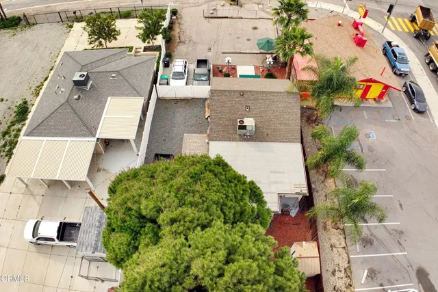 an aerial view of residential houses with outdoor space