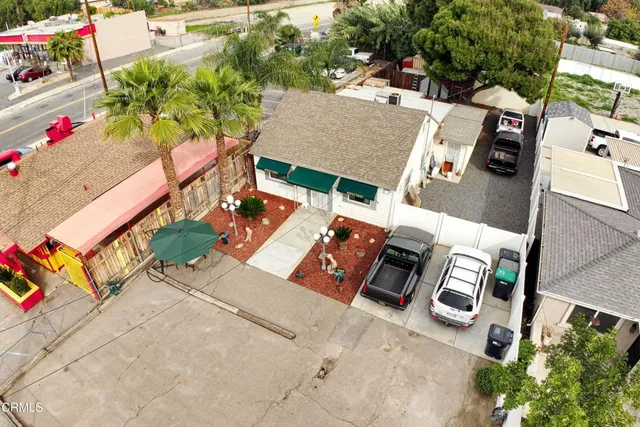 an aerial view of a house with outdoor space