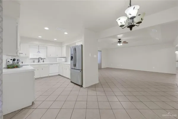 a view of a kitchen with electric appliances