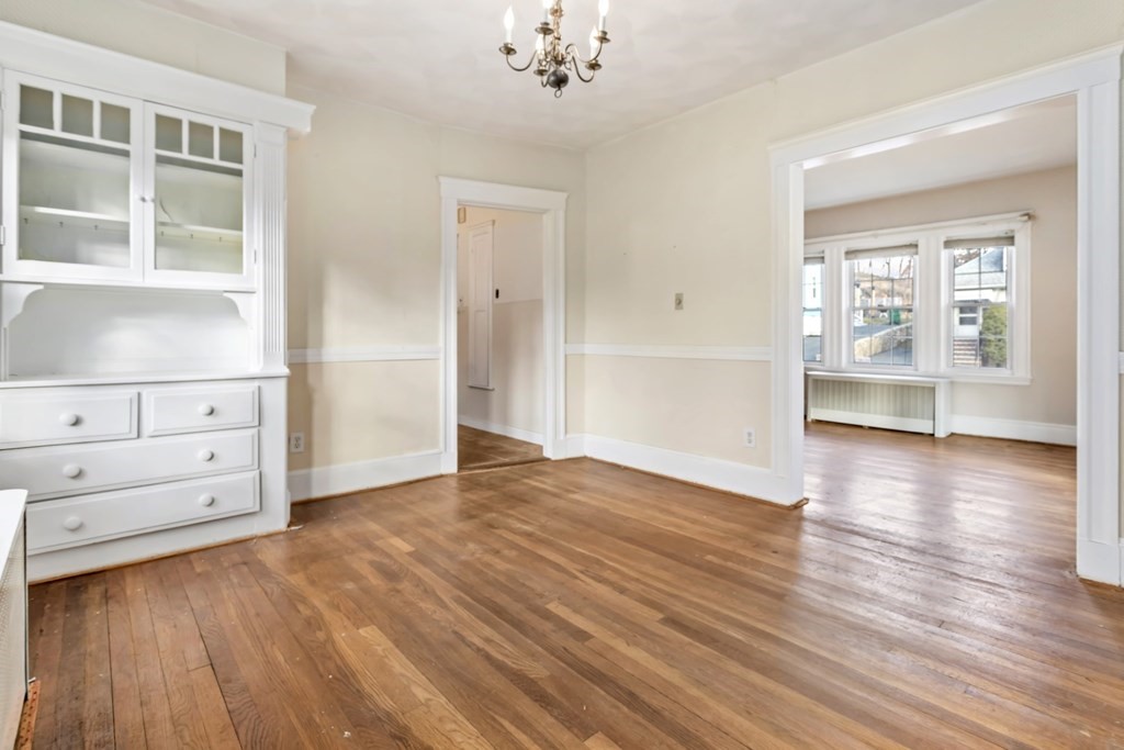 78 Ashcroft Road Medford, MA 02155 - Photo 16 of 34 wooden floor in an empty room with a window