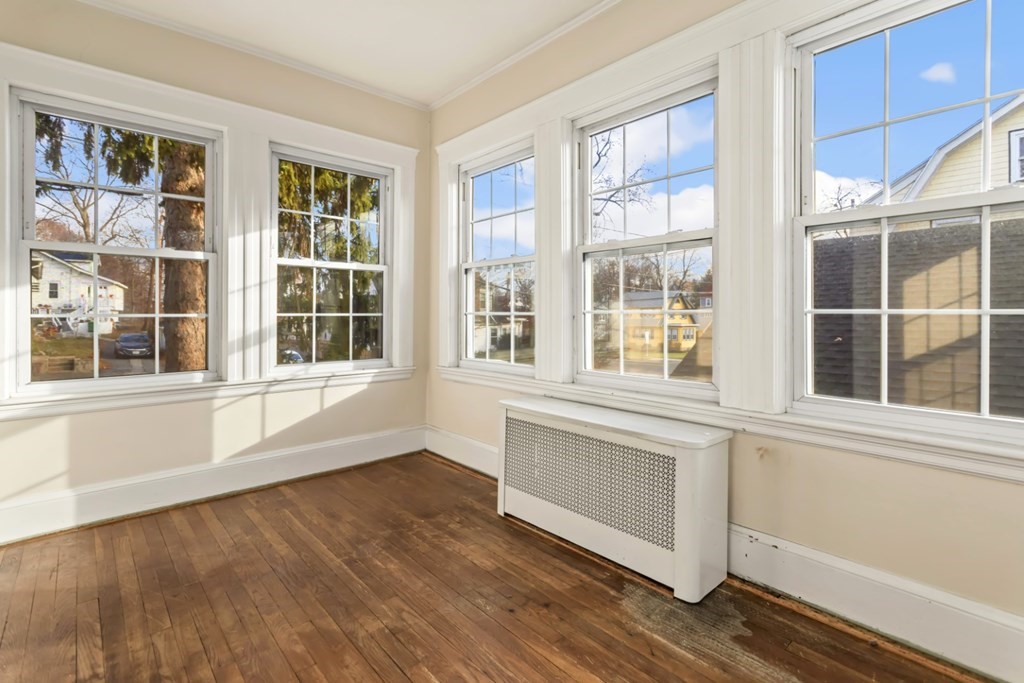 78 Ashcroft Road Medford, MA 02155 - Photo 18 of 34 an empty room with wooden floor and windows
