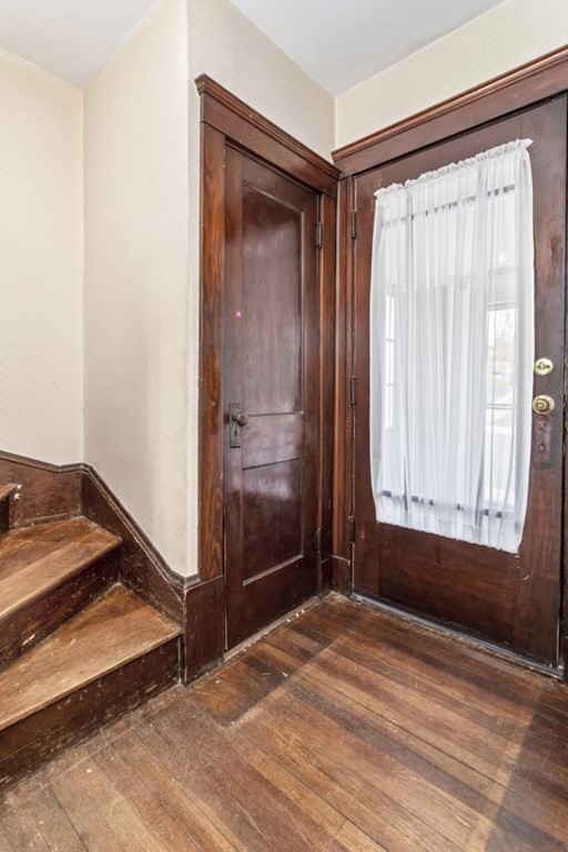 78 Ashcroft Road Medford, MA 02155 - Photo 5 of 34 a view of an empty room with wooden floor and a window