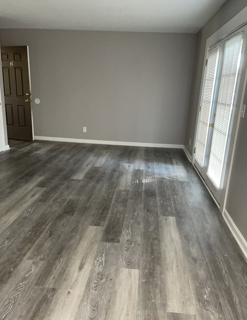 1389 Monomoy Street, Unit B2 Aurora, IL 60506 - Photo 2 of 6 wooden floor in an empty room