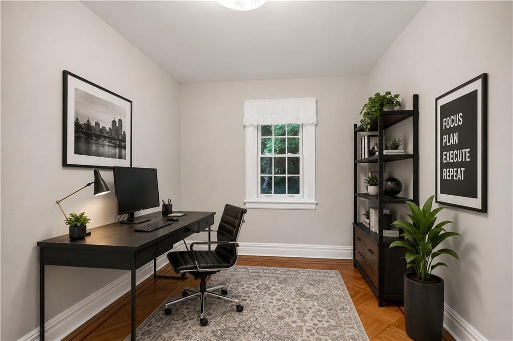 7607 Colonial Road Brooklyn, NY 11209 - Photo 21 of 35 a view of a workspace with furniture and a potted plant