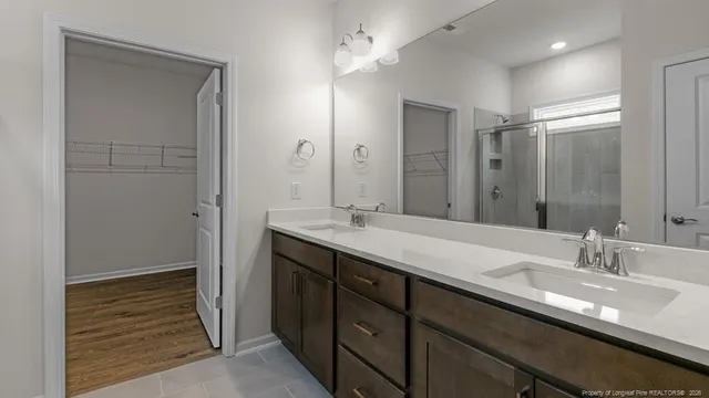 a bathroom with a sink toilet vanity and bathtub