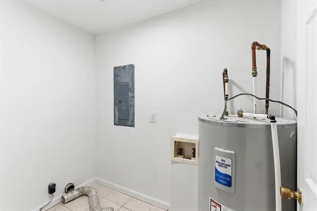 a view of storage and utility room with two washing machine