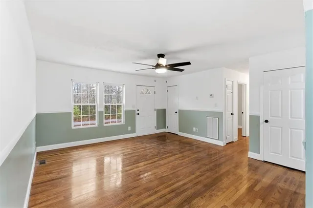 a view of an empty room with glass door