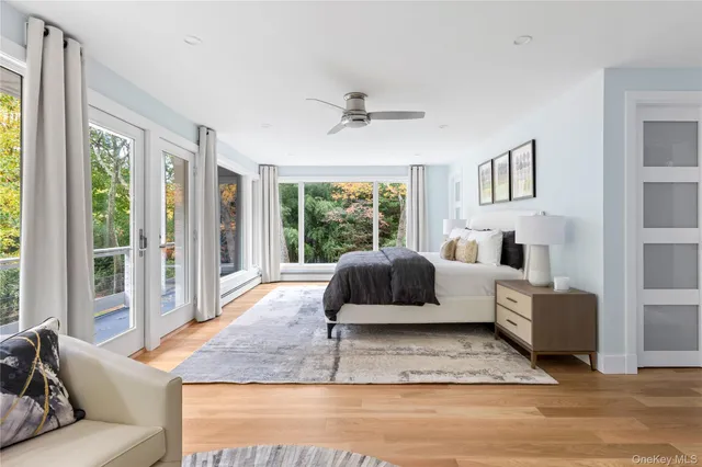 a spacious bedroom with a large bed and a window