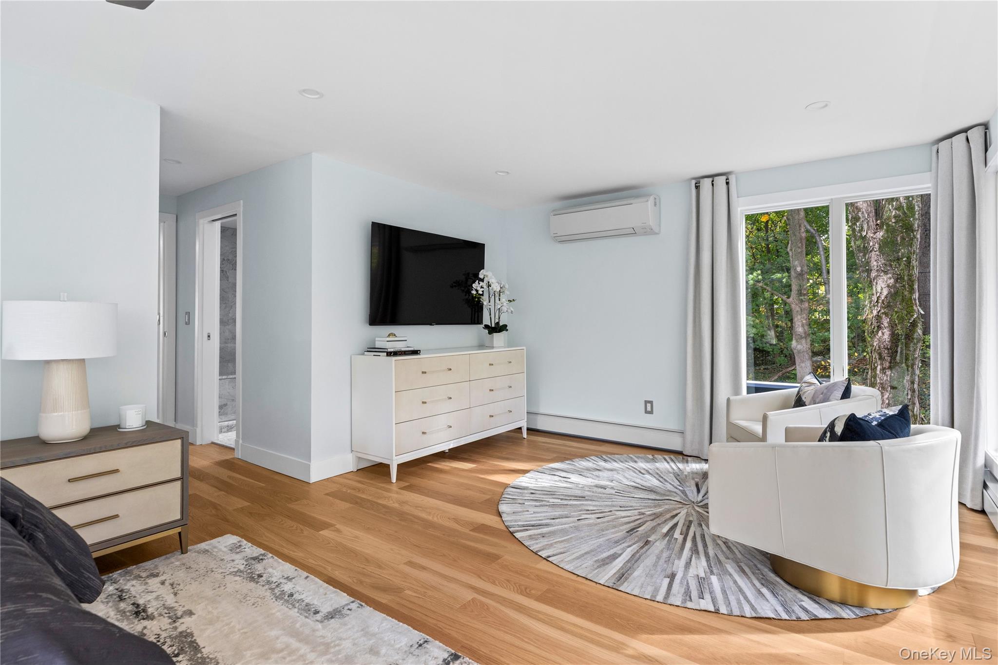 25 Wood Road Sands Point, NY 11050 - Photo 20 of 33 a living room with furniture and a flat screen tv