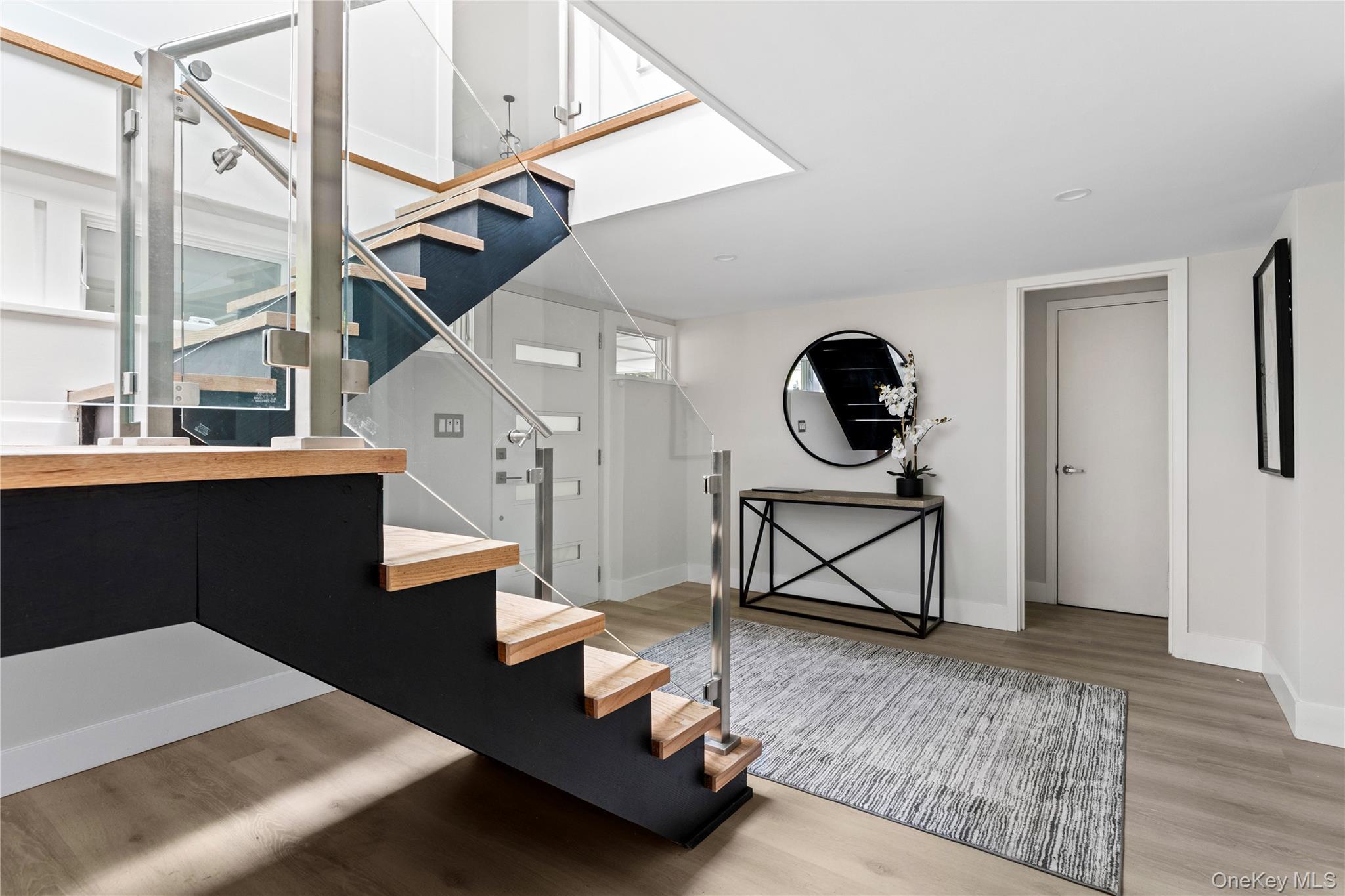 25 Wood Road Sands Point, NY 11050 - Photo 2 of 33 a living room with furniture and a wooden floor