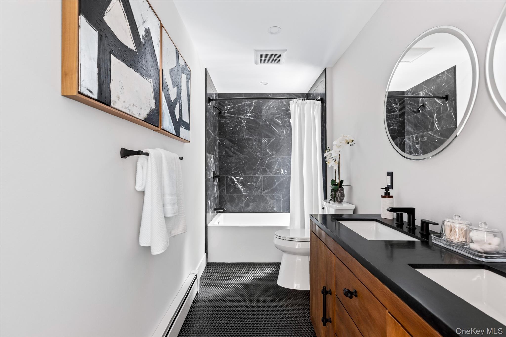 25 Wood Road Sands Point, NY 11050 - Photo 21 of 33 a bathroom with a sink toilet and shower