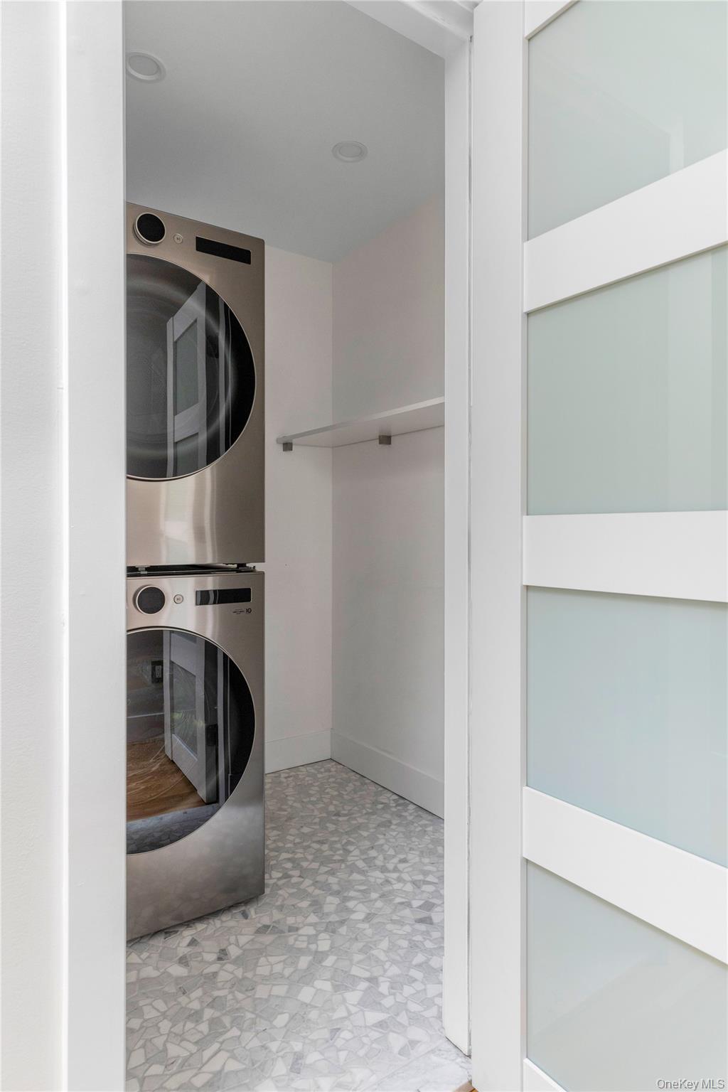 25 Wood Road Sands Point, NY 11050 - Photo 26 of 33 a view of a storage and utility room with washer and dryer