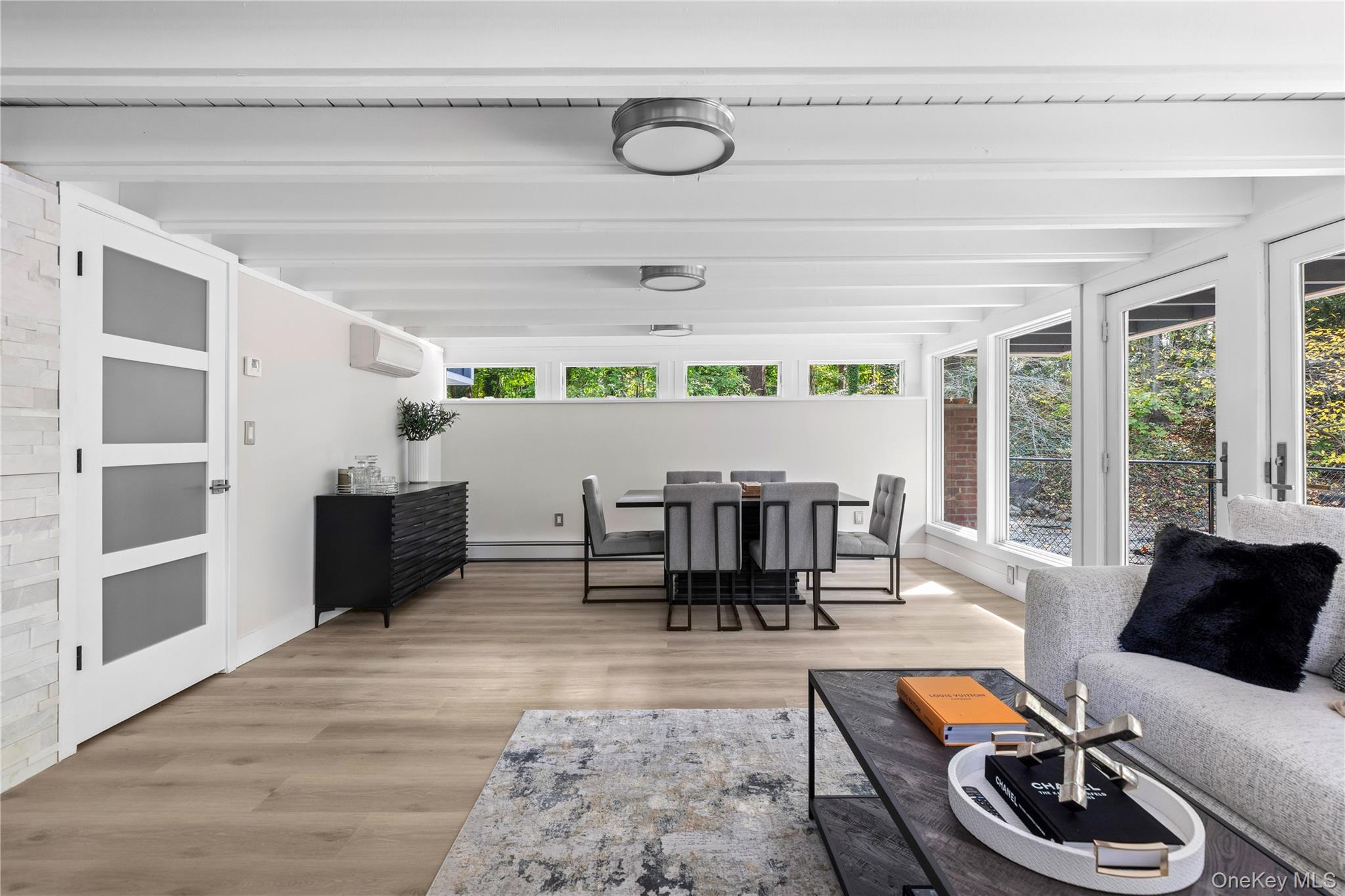 25 Wood Road Sands Point, NY 11050 - Photo 29 of 33 a dining room with furniture and window