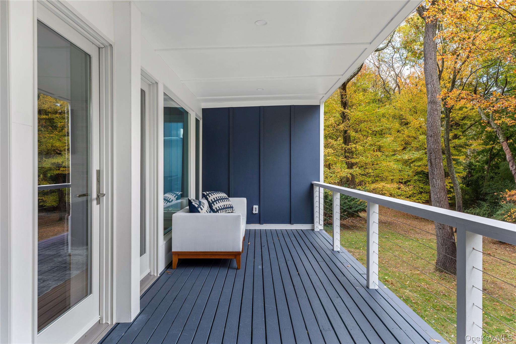 25 Wood Road Sands Point, NY 11050 - Photo 31 of 33 a balcony with wooden floor and furniture