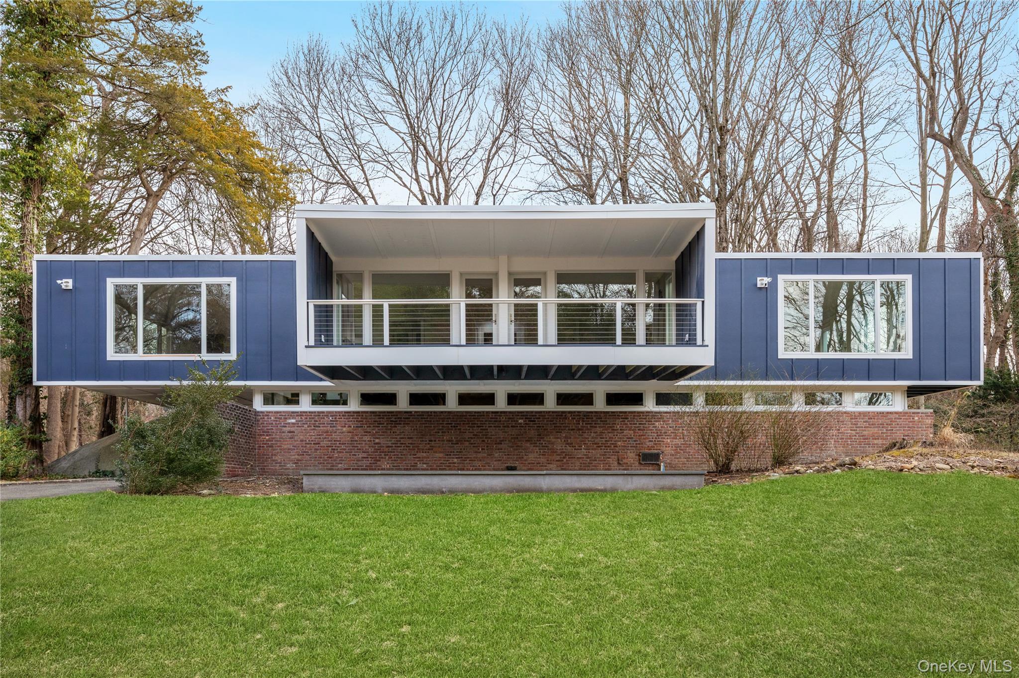 25 Wood Road Sands Point, NY 11050 - Photo 32 of 33 front view of a house with a yard