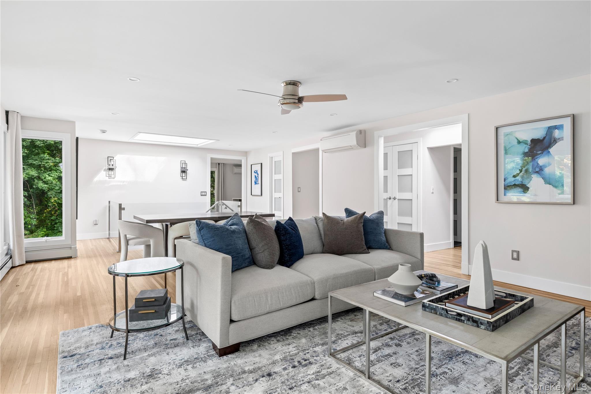 25 Wood Road Sands Point, NY 11050 - Photo 10 of 33 a living room with furniture and a table