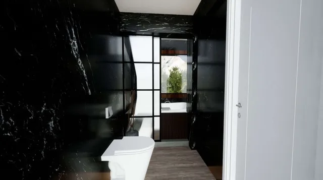 a bathroom with a toilet and a mirror