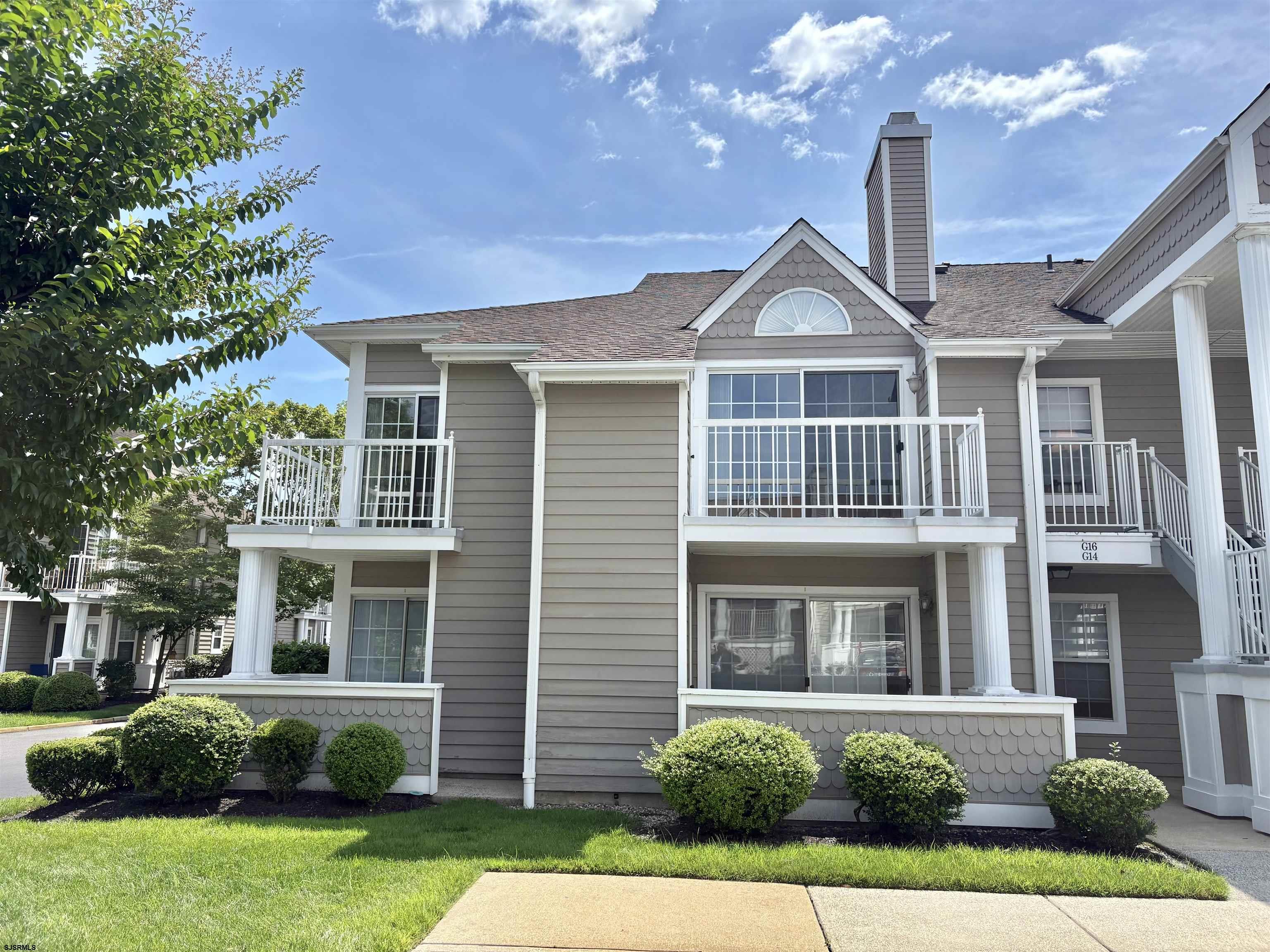 550 Central Avenue, Unit G16 CONSTITUTION CT Linwood, NJ 08221 - Photo 1 of 13 a front view of a house with garden