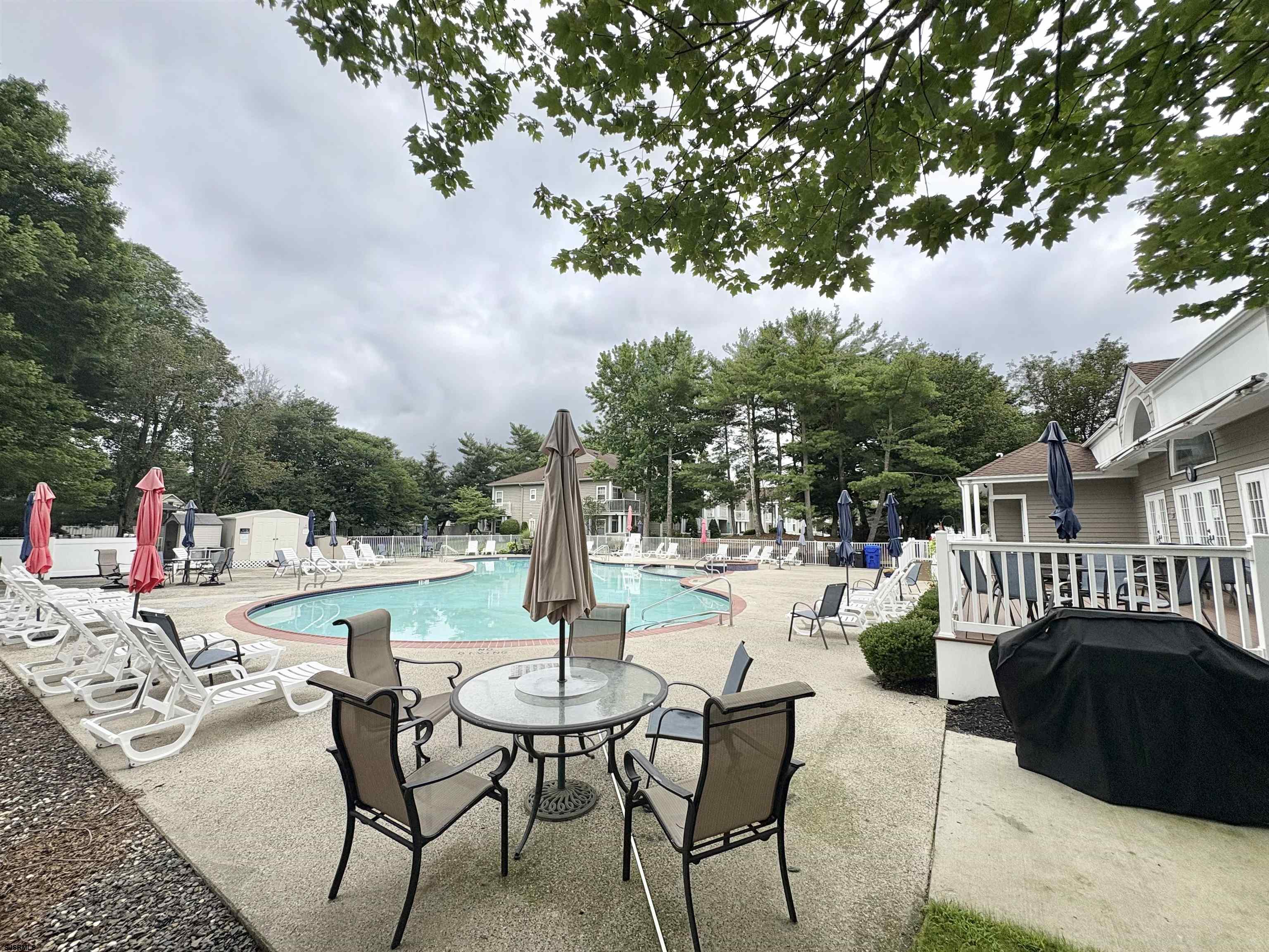 550 Central Avenue, Unit G16 CONSTITUTION CT Linwood, NJ 08221 - Photo 12 of 13 a view of a patio with a table and chairs