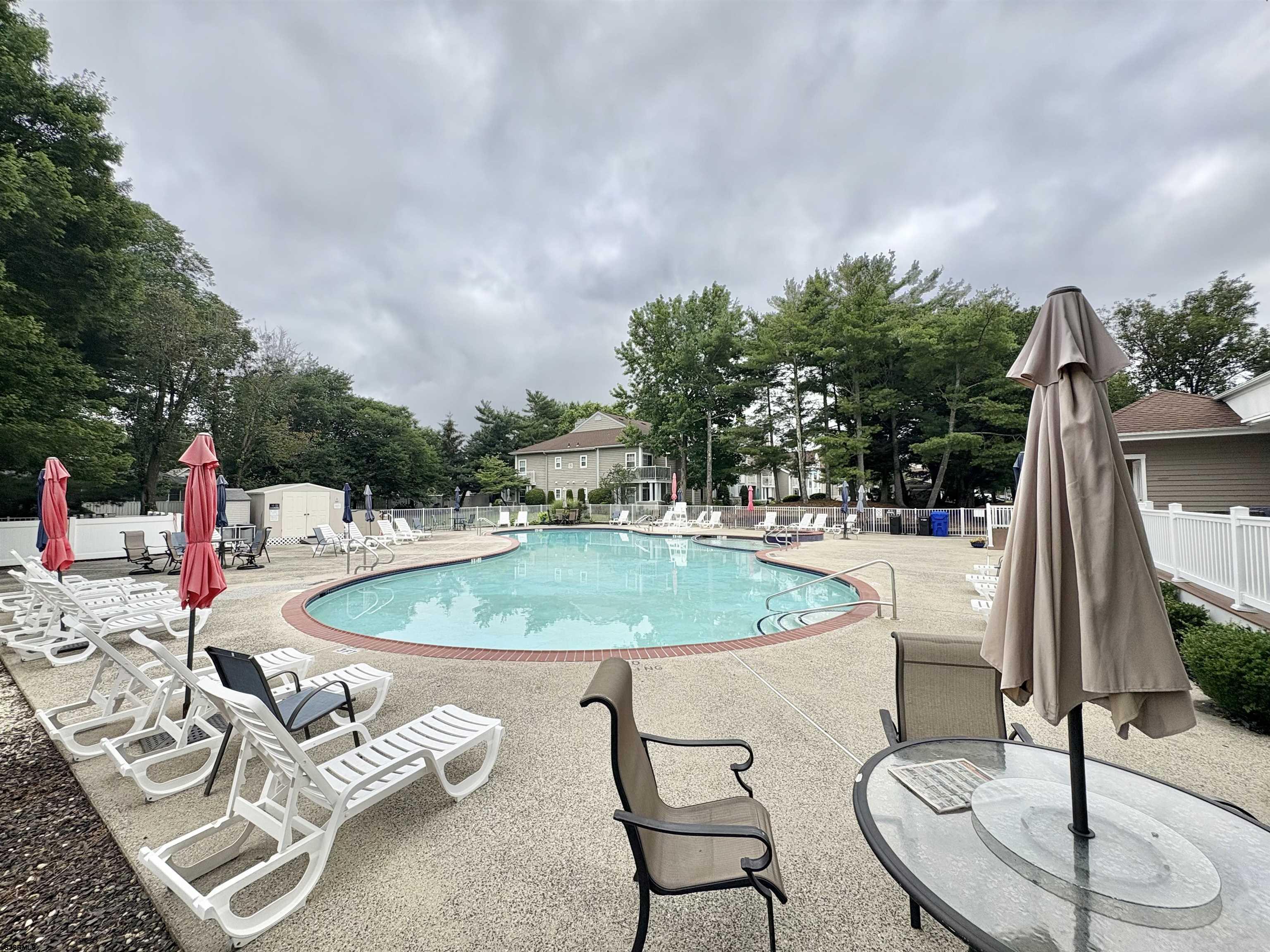 550 Central Avenue, Unit G16 CONSTITUTION CT Linwood, NJ 08221 - Photo 13 of 13 a backyard of a house with table and chairs