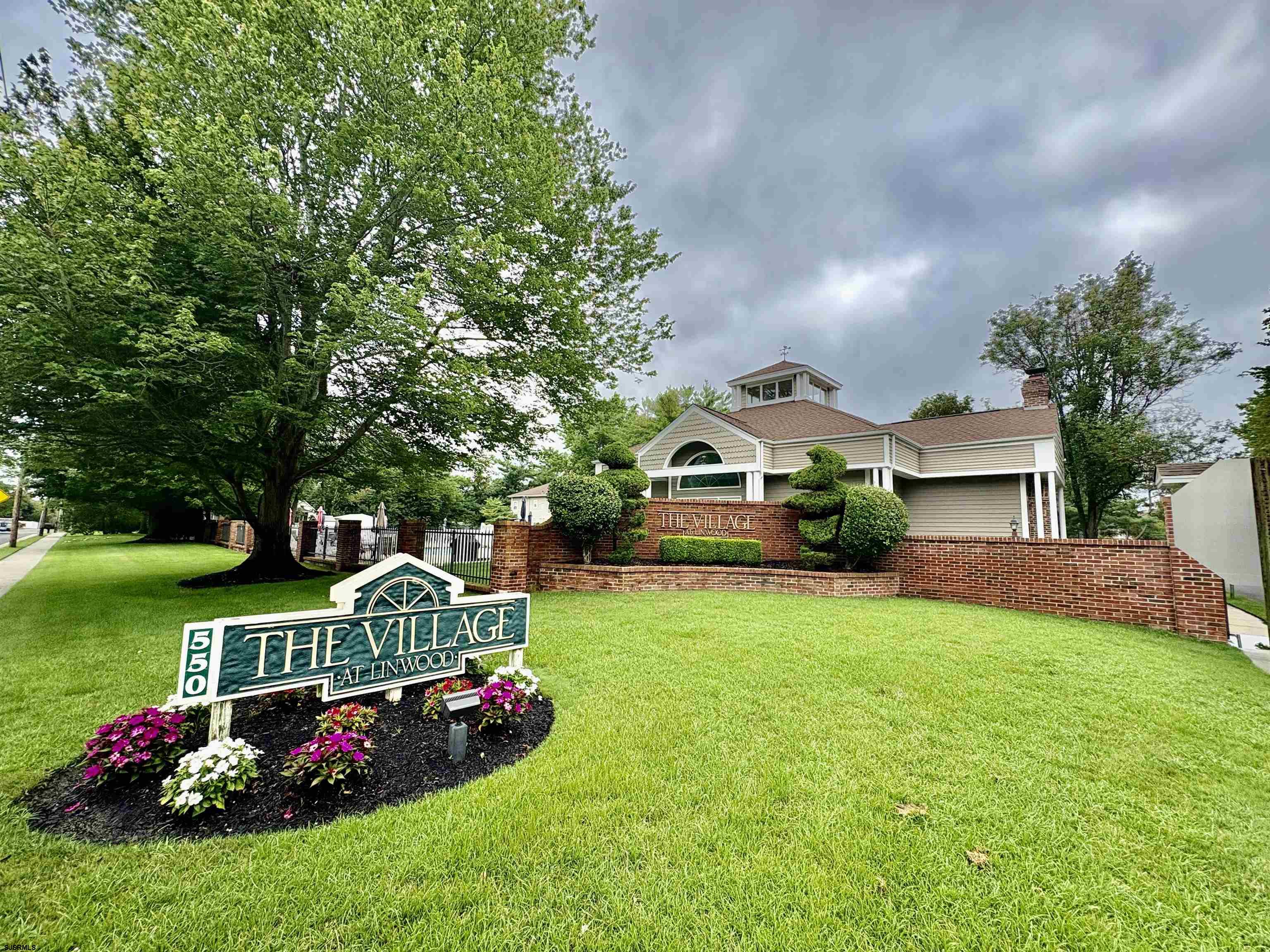550 Central Avenue, Unit G16 CONSTITUTION CT Linwood, NJ 08221 - Photo 2 of 13 a front view of a house with garden
