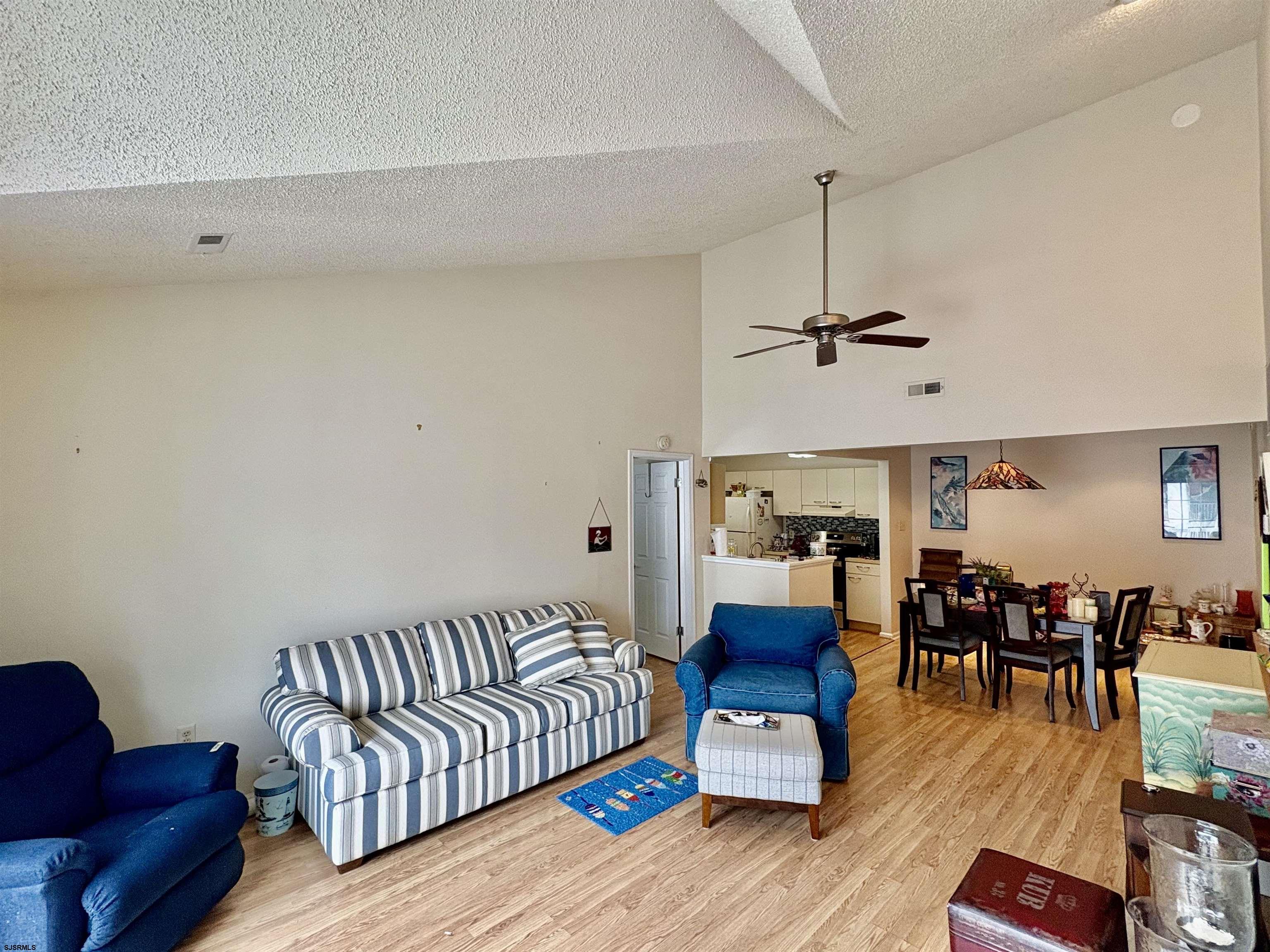 550 Central Avenue, Unit G16 CONSTITUTION CT Linwood, NJ 08221 - Photo 4 of 13 a living room with furniture and wooden floor