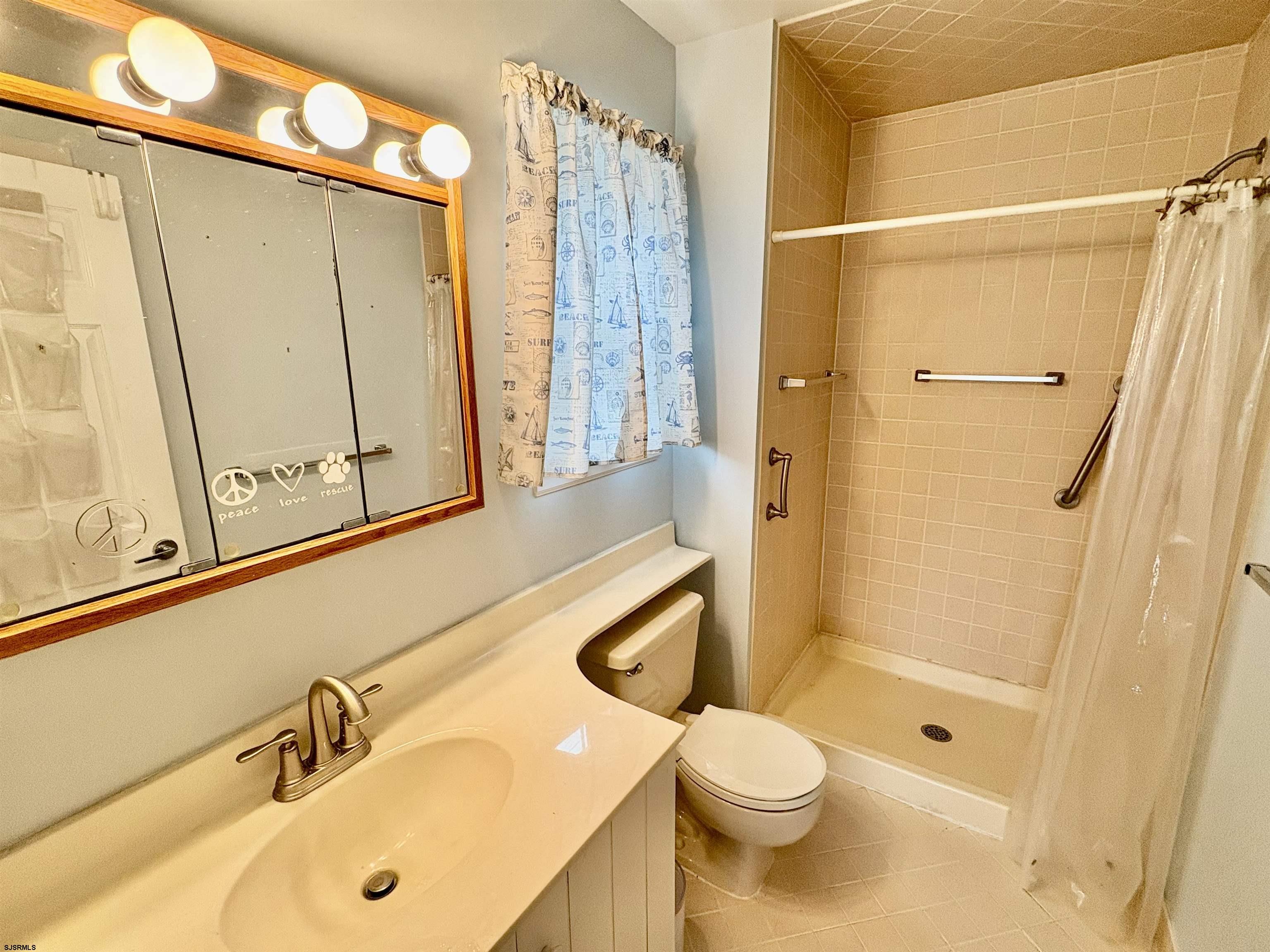 550 Central Avenue, Unit G16 CONSTITUTION CT Linwood, NJ 08221 - Photo 9 of 13 a bathroom with a sink toilet and shower